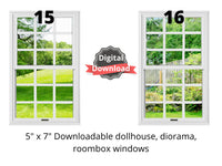 white dollhouse windows with green grass, trees, and fencing